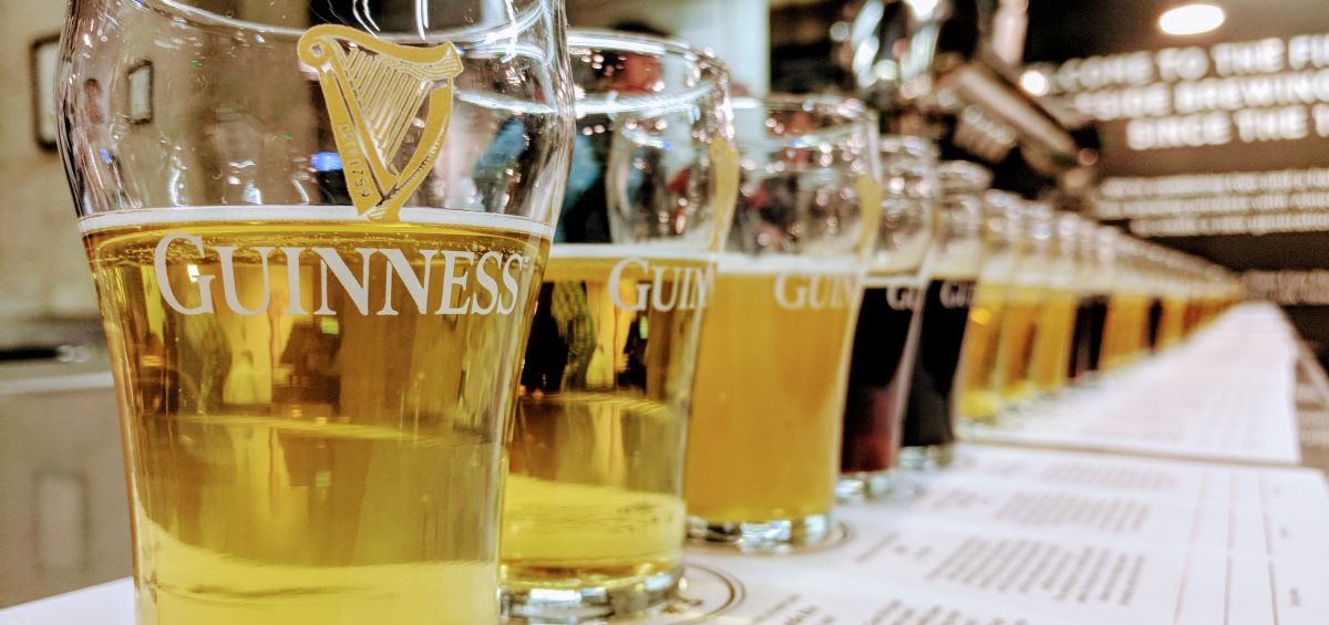 Guinness glasses lined up with Guinness Blond and Guinness Stout