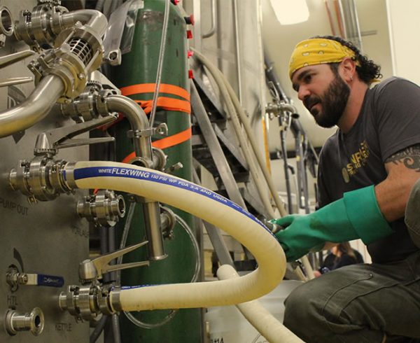 Sunriver Brewing Company's Brett Thomas working in the brewery