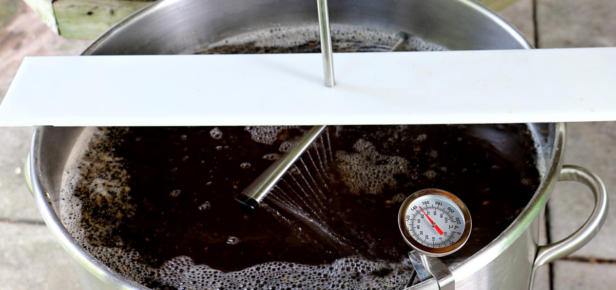 Sparging Mash for Brown Ale with sparge arm over mash tun sprinkling water