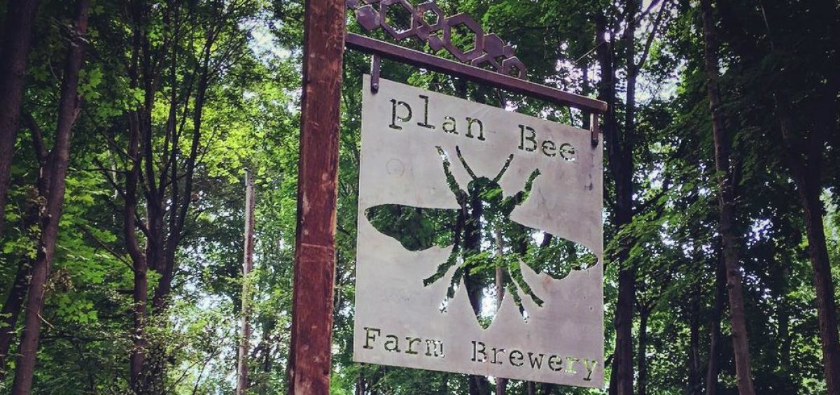 Plan Bee Farm Brewery logo sign on farm