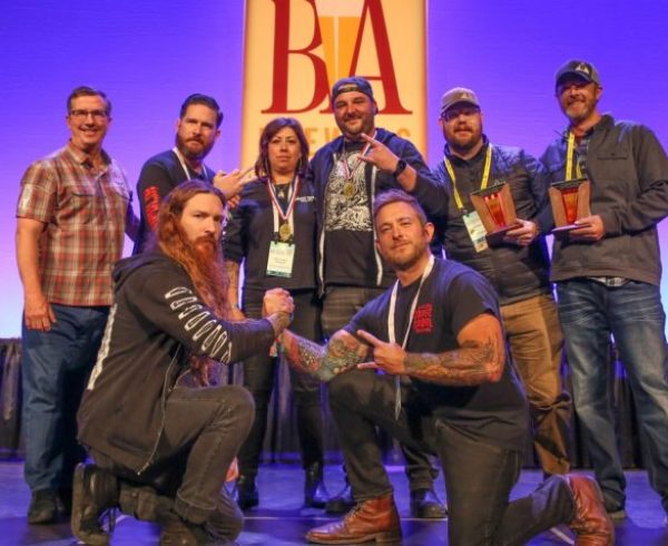 Ghost Town Brewing Receiving 2022 GABF Brewery of the Year Award on stage in Denver, CA.